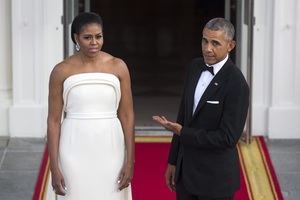 El presidente de los Estados Unidos Barack Obama (d) y la primera dama Michelle Obama.