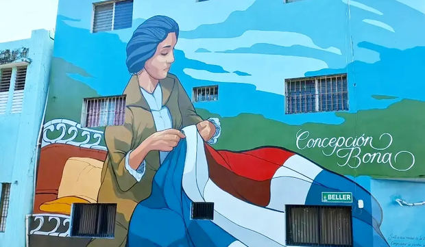 Idealizada y alejada de sus características de mujer mulata, Concepción Bona cose la primera bandera dominicana.